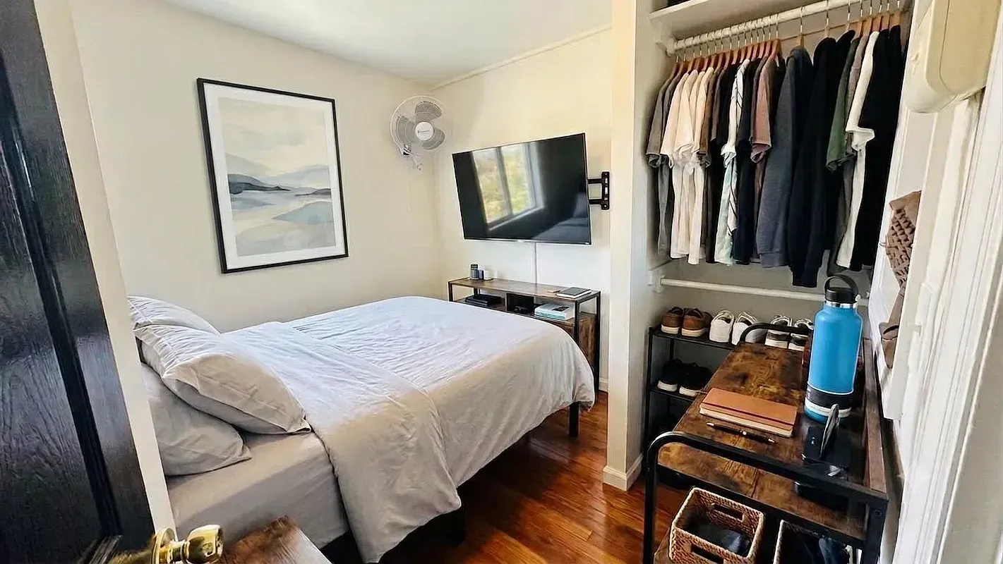 One bedroom at 518 East 6th Street, bedroom with desk and wall-mounted TV