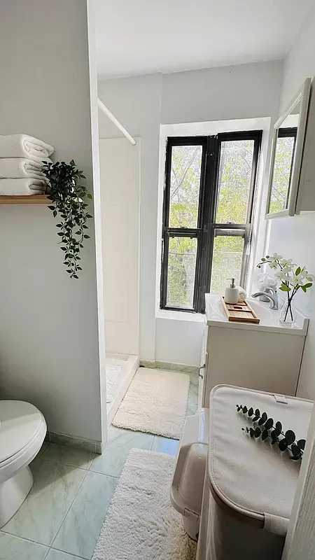 One bedroom at 518 East 6th Street, bathroom with window