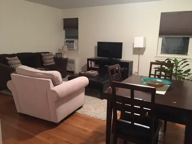 Two bedroom in Whitestone, living room with sofa and dining table
