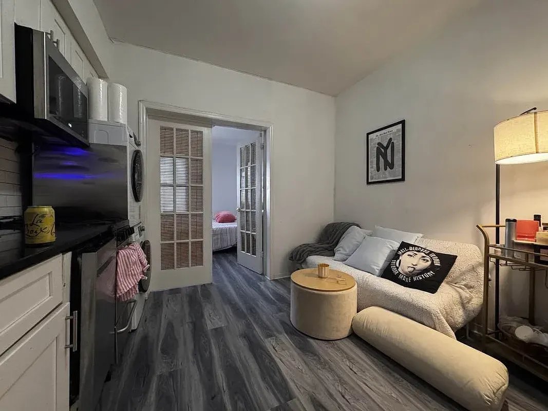 Two bedroom at 17 Saint Marks Place, living room with French doors and kitchen counter