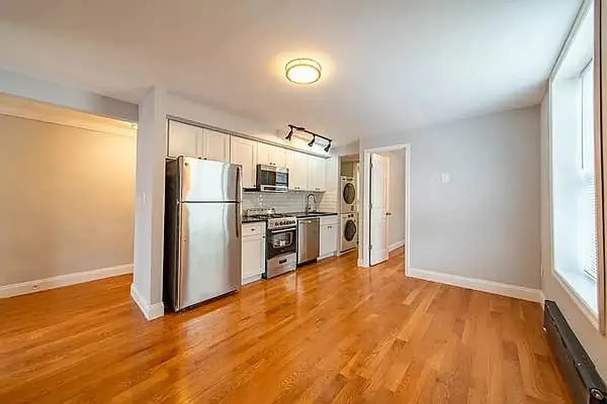 Three bedroom at 93 Avenue B, open kitchen with stainless appliances