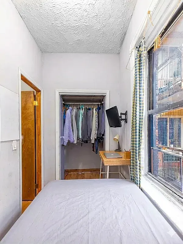 Three bedroom at 17 Saint Marks Place, bedroom with closet and window