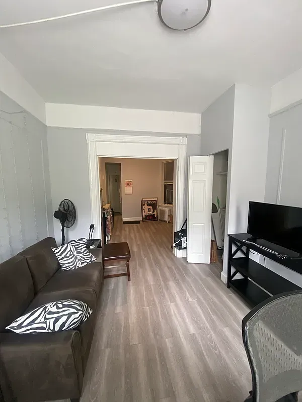 Three bedroom at 17 Saint Marks Place, living room with hardwood floors