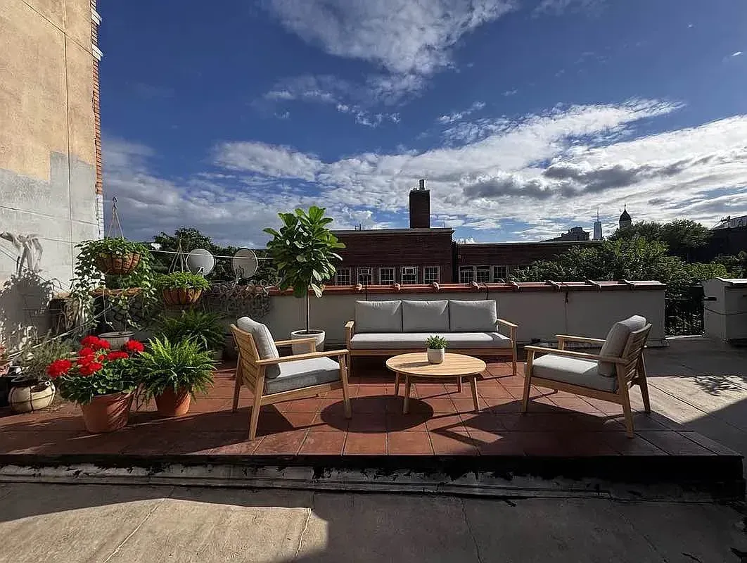 Roof terrace at 93 Avenue B with outdoor seating and planters
