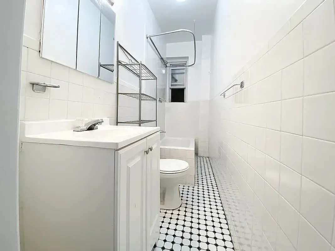 Three bedroom at 34½ Saint Marks Place, bathroom with tub and tiled walls