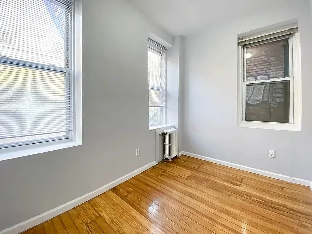 Three bedroom at 34½ Saint Marks Place, empty bedroom with two windows