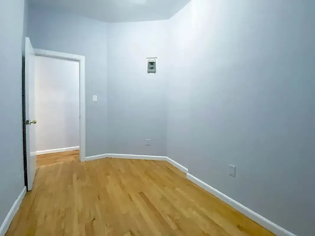 Three bedroom at 34½ Saint Marks Place, empty bedroom with hardwood floors
