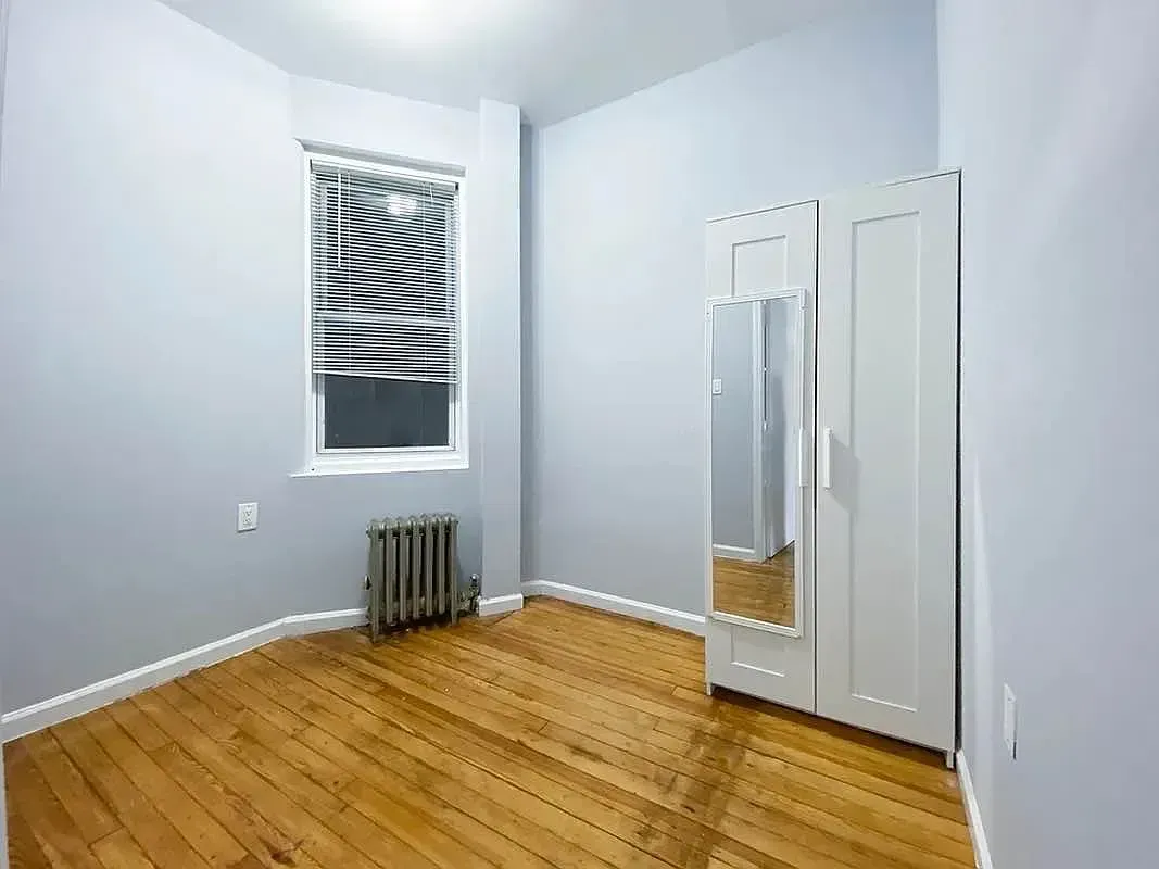 Three bedroom at 34½ Saint Marks Place, empty bedroom with mirrored closet