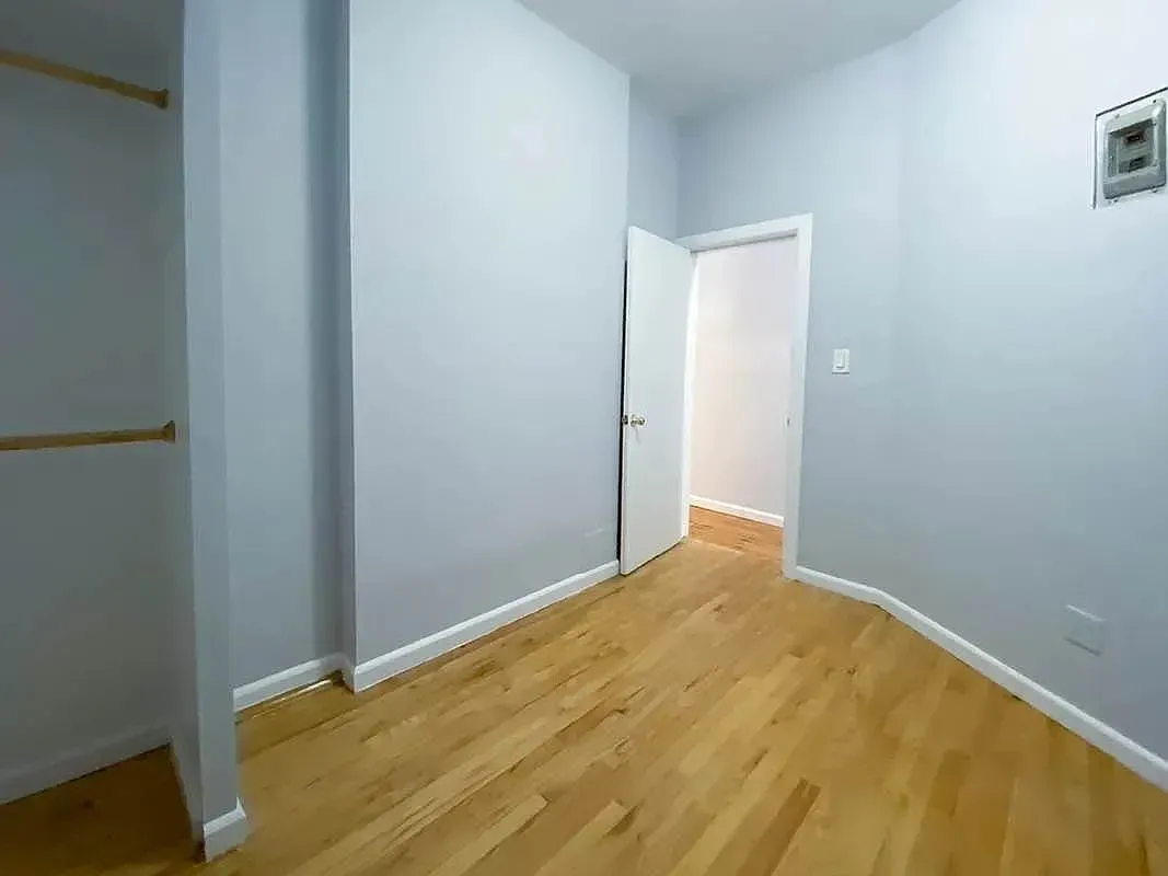 Three bedroom at 34½ Saint Marks Place, empty bedroom with closet shelf
