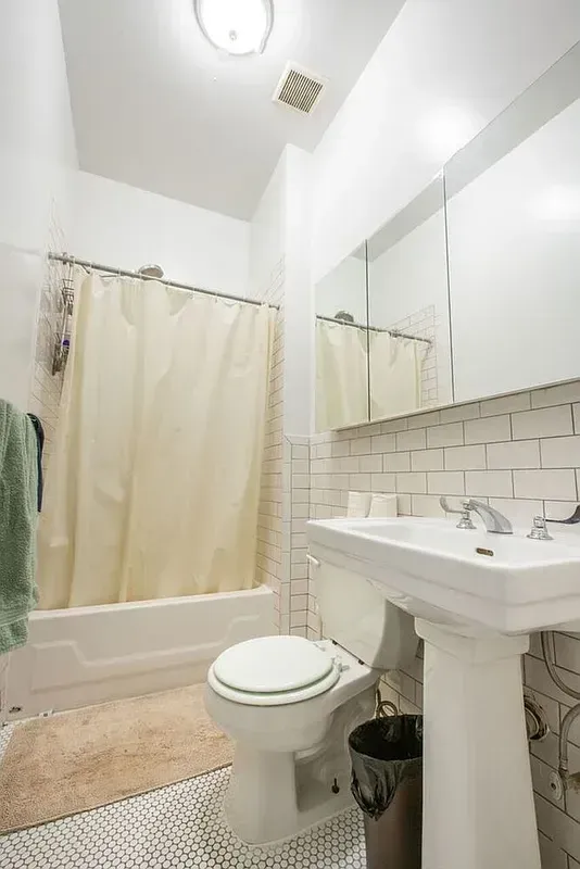 Four bedroom at 13 Saint Marks Place, bathroom with tub and pedestal sink