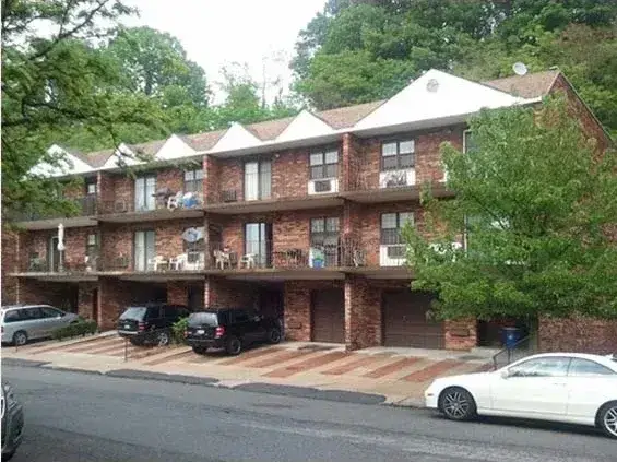 Douglaston, attached brick houses with garages